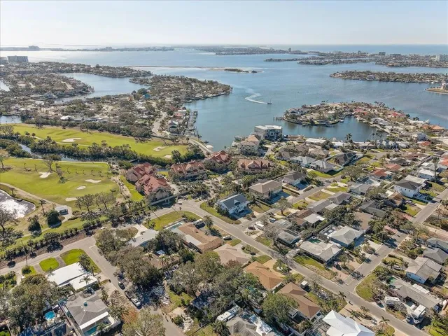 an aerial view of a house with a lake view