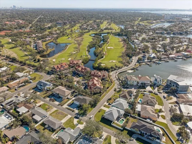 an aerial view of residential building and lake
