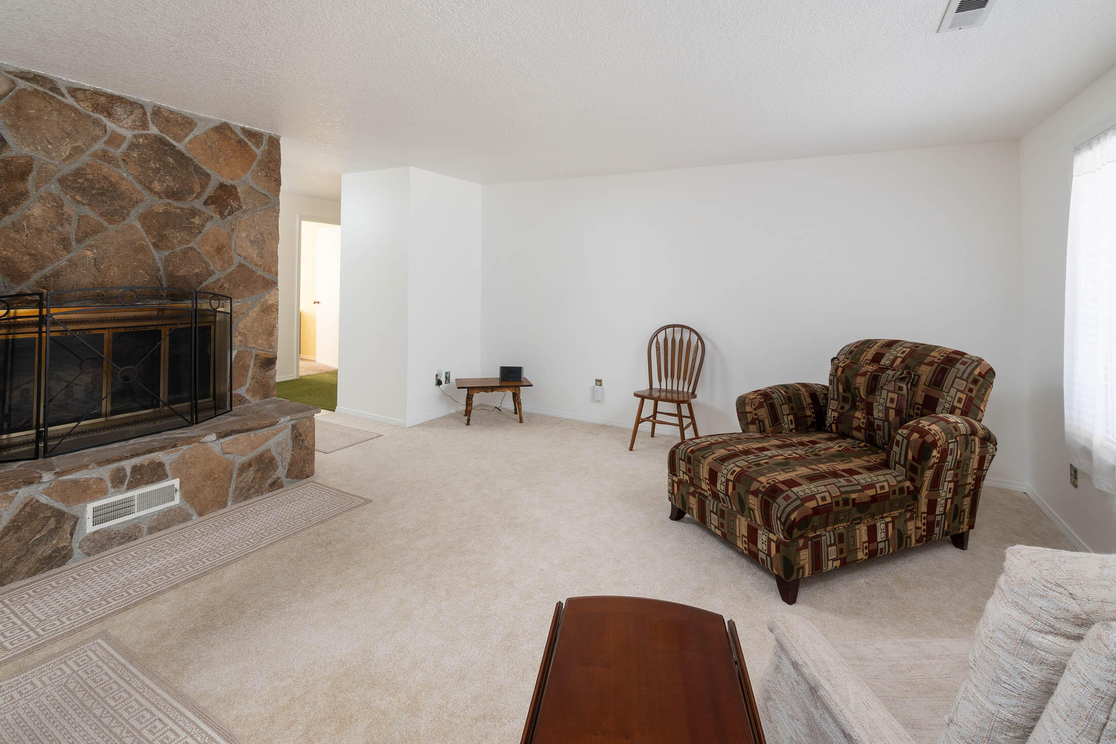 20420 Mainline Road Bend, OR 97702 - Photo 16 of 29 a living room with furniture and a fireplace