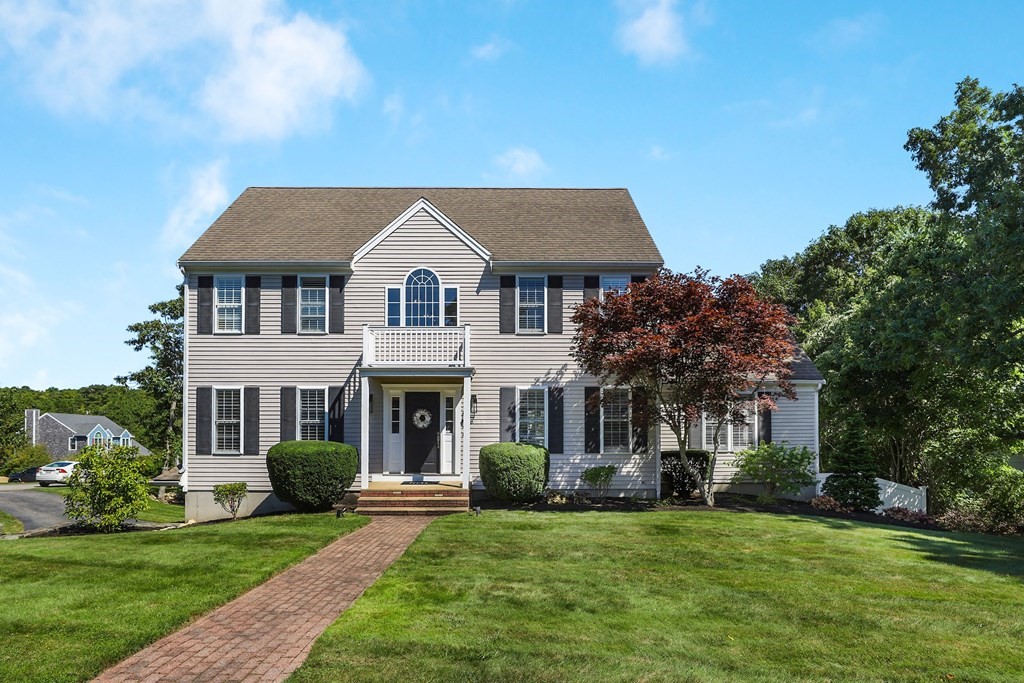 16 Oakbluff Road Sagamore Beach, MA 02562 - Photo 1 of 34 a front view of a house with a yard