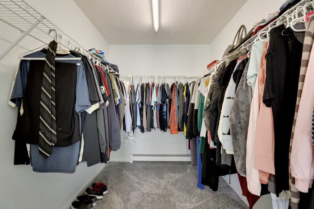 16 Oakbluff Road Sagamore Beach, MA 02562 - Photo 14 of 34 a view of walk in closet with clothes and shoes