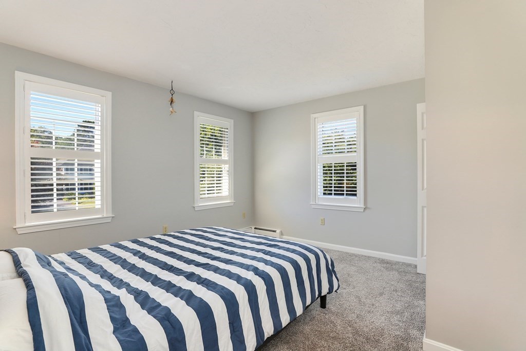 16 Oakbluff Road Sagamore Beach, MA 02562 - Photo 18 of 34 a bedroom with a bed and a window