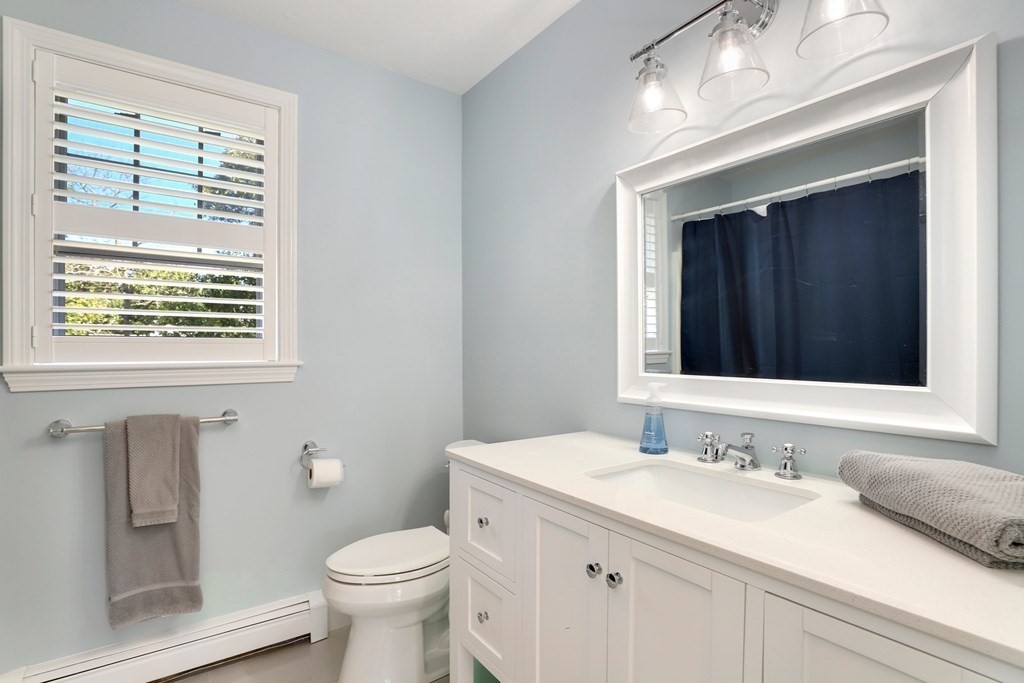 16 Oakbluff Road Sagamore Beach, MA 02562 - Photo 20 of 34 a bathroom with a granite countertop sink toilet and mirror