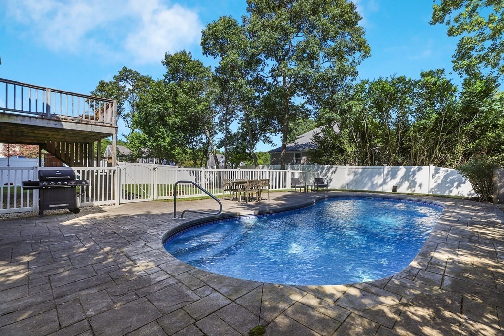 16 Oakbluff Road Sagamore Beach, MA 02562 - Photo 24 of 34 a view of a swimming pool with a sitting area