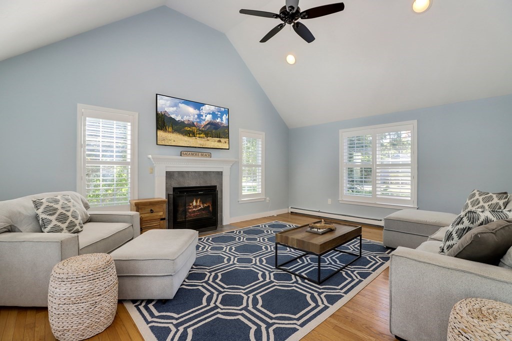 16 Oakbluff Road Sagamore Beach, MA 02562 - Photo 7 of 34 a living room with furniture and a fireplace