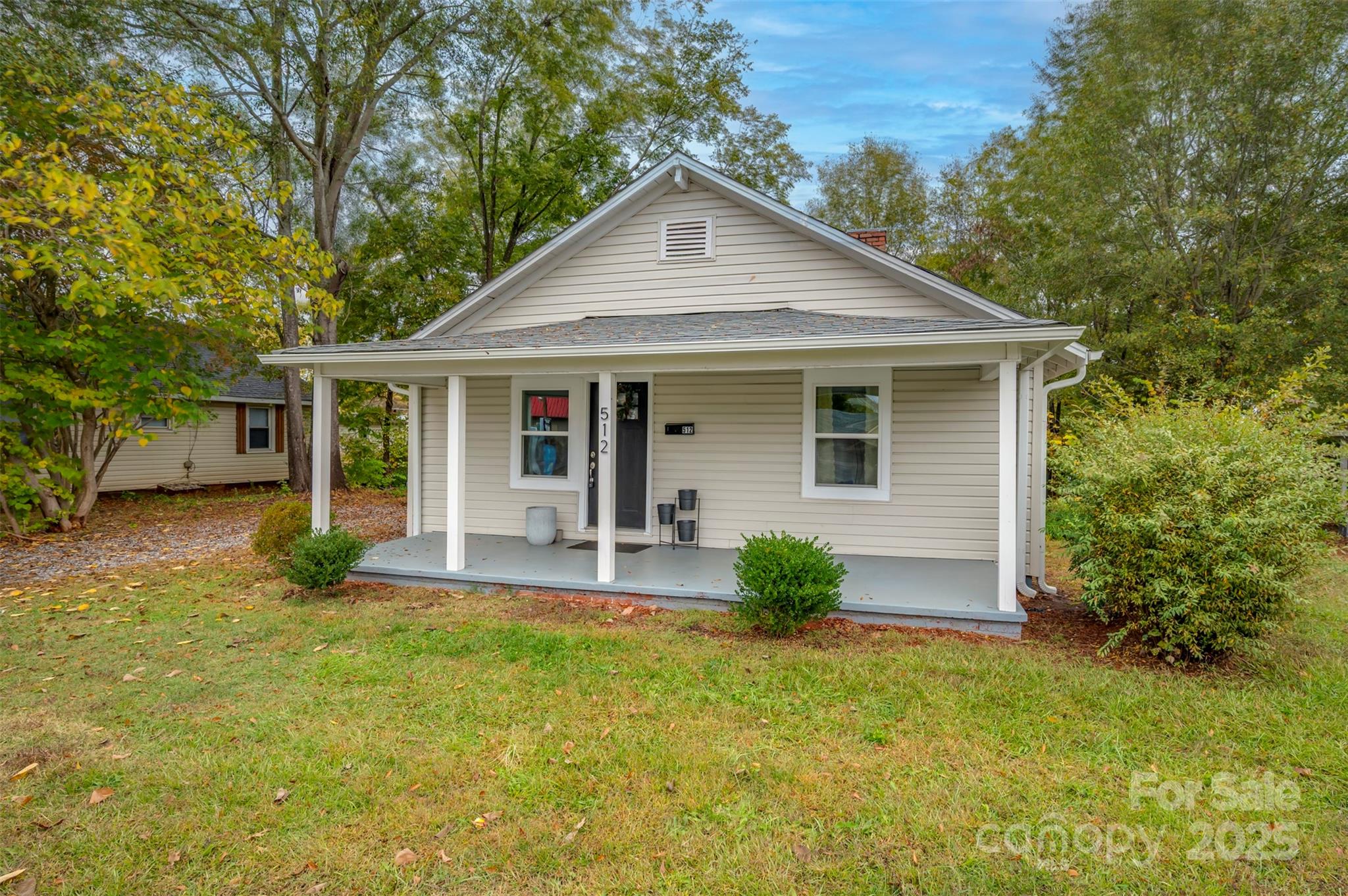 512 Spindale Street Spindale, NC 28160 - Photo 1 of 25 a front view of a house with yard and green space