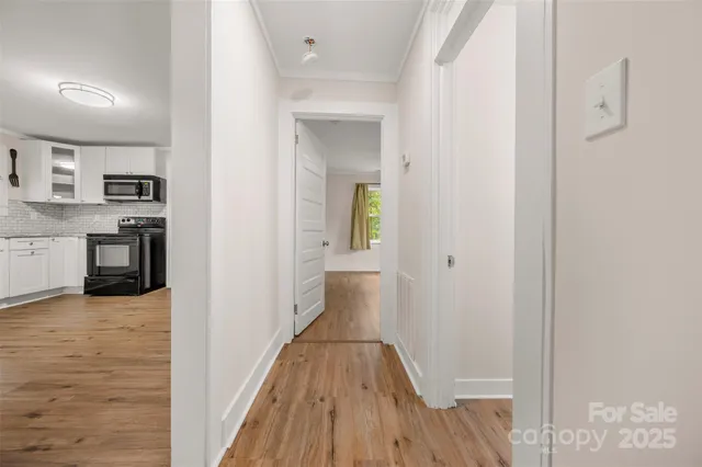 a view of a kitchen from the hallway