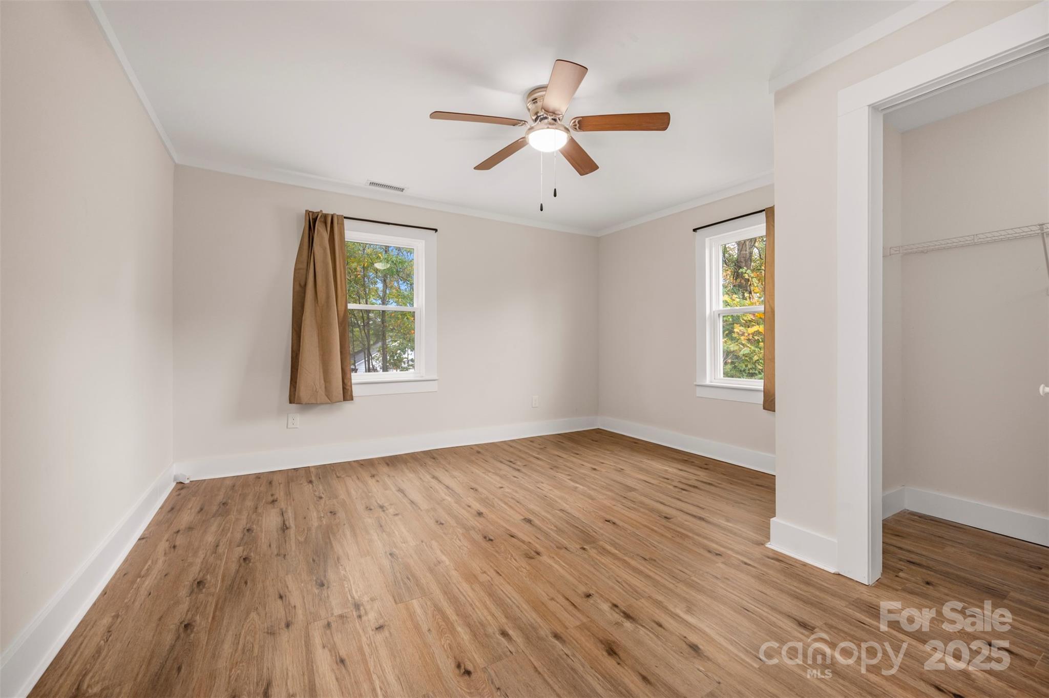 512 Spindale Street Spindale, NC 28160 - Photo 14 of 25 a view of an empty room with wooden floor and a window