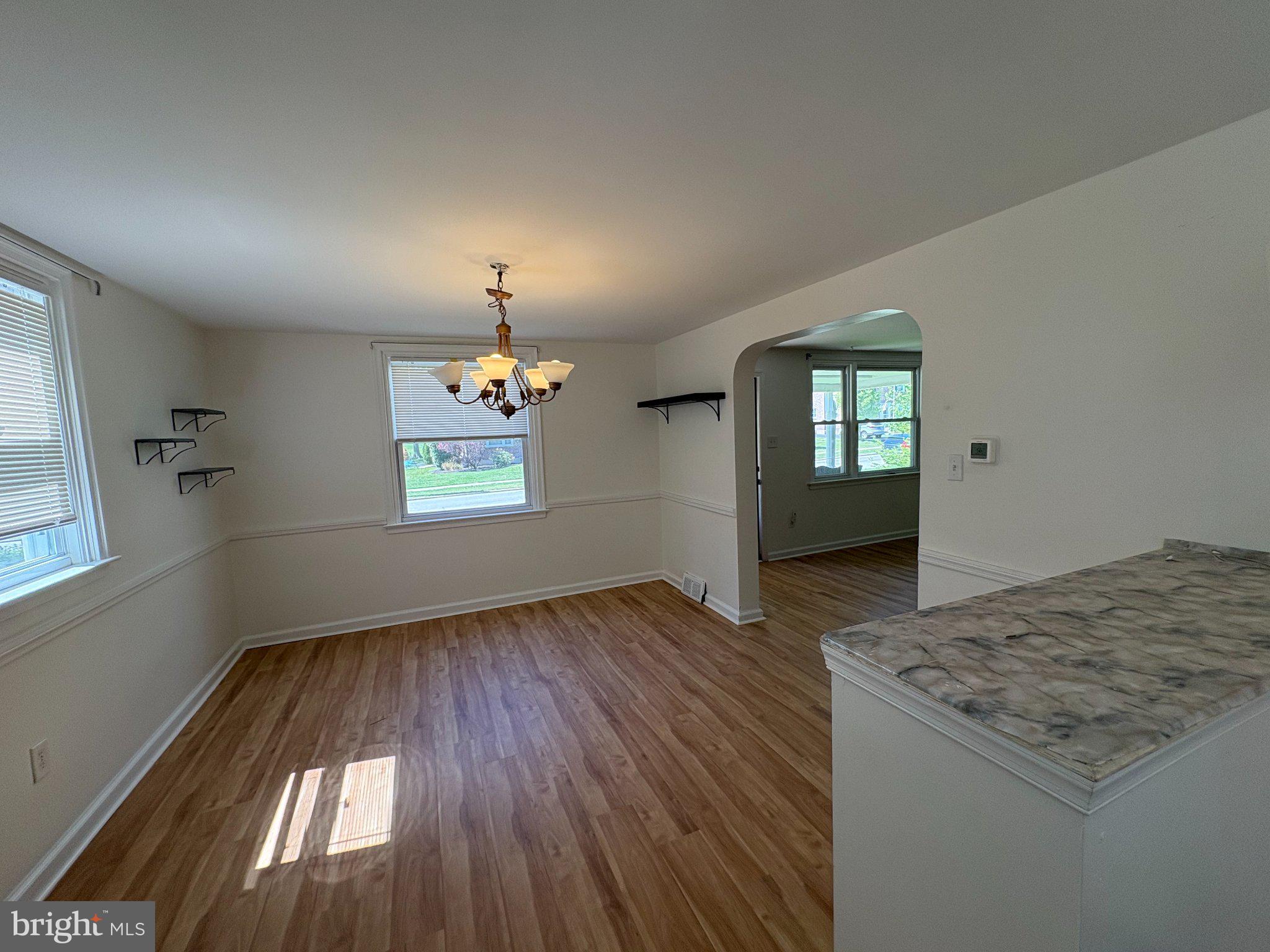 2515 Woodleigh Road Havertown, PA 19083 - Photo 21 of 31 wooden floor in an empty room with a window
