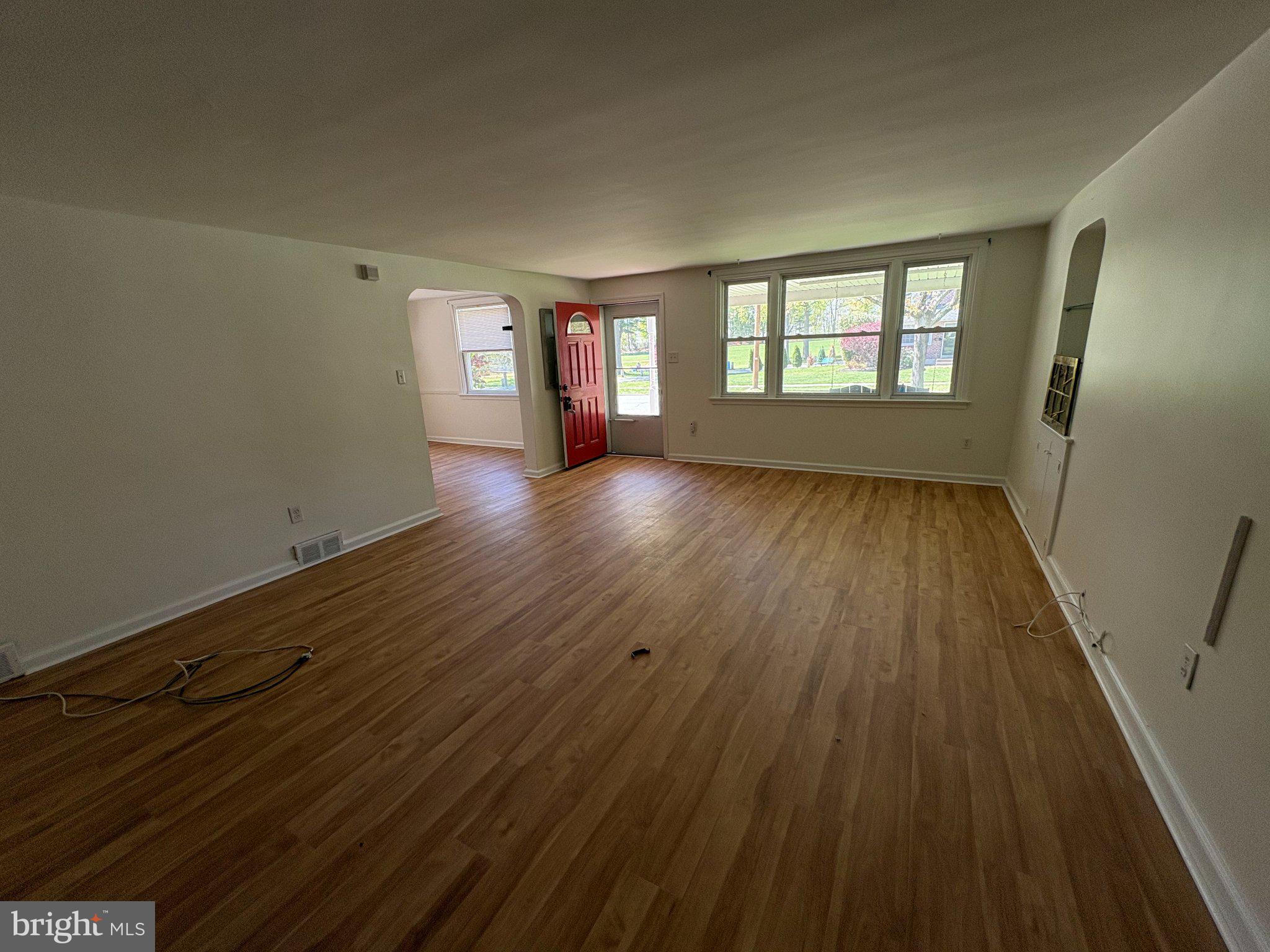 2515 Woodleigh Road Havertown, PA 19083 - Photo 4 of 31 wooden floor in an empty room with a window