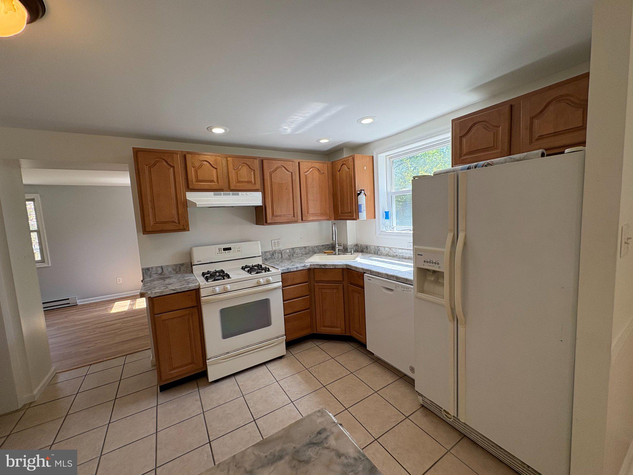 2515 Woodleigh Road Havertown, PA 19083 - Photo 8 of 31 a kitchen with a refrigerator sink and microwave