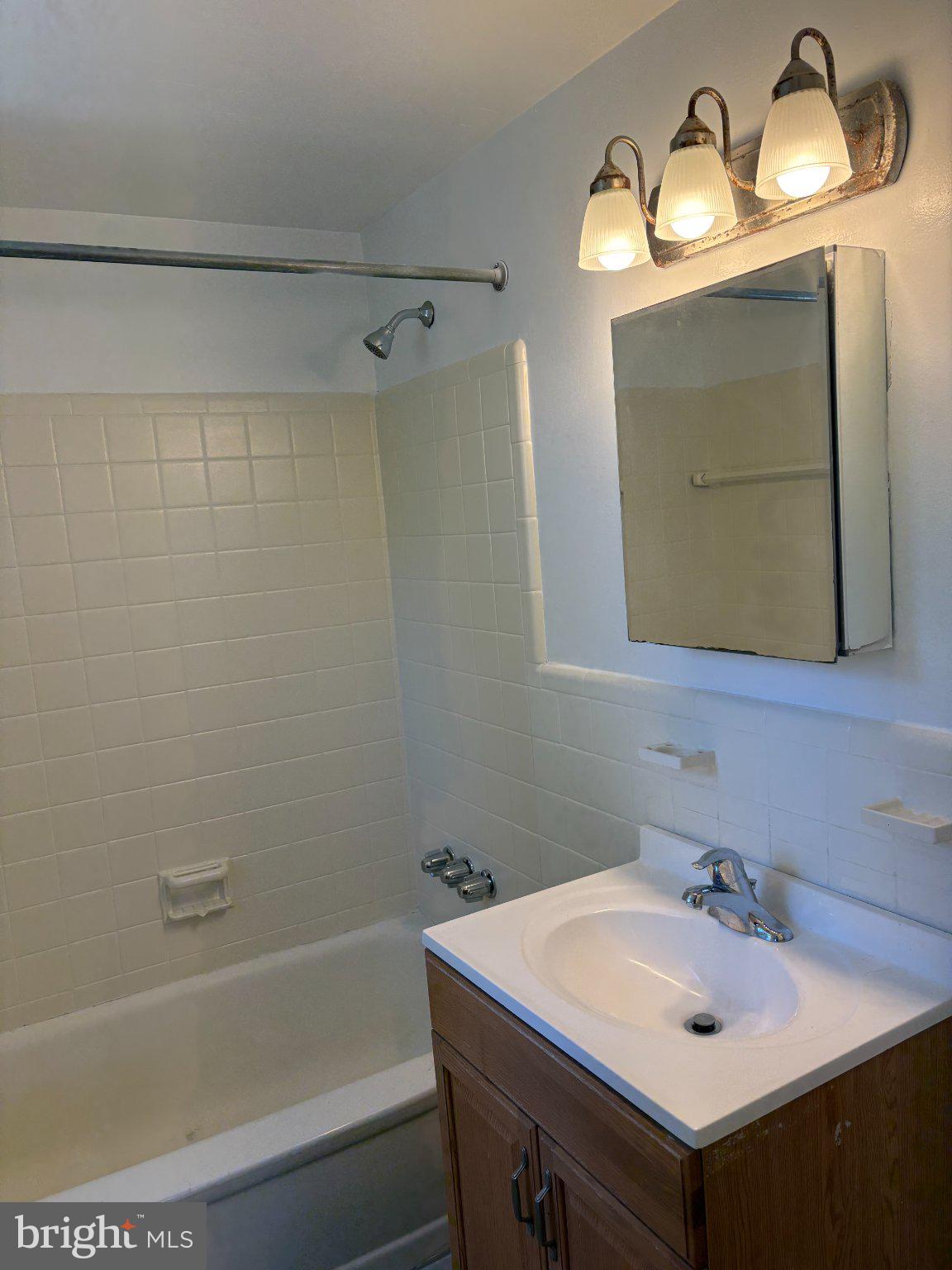 2515 Woodleigh Road Havertown, PA 19083 - Photo 9 of 31 a bathroom with a sink and a mirror