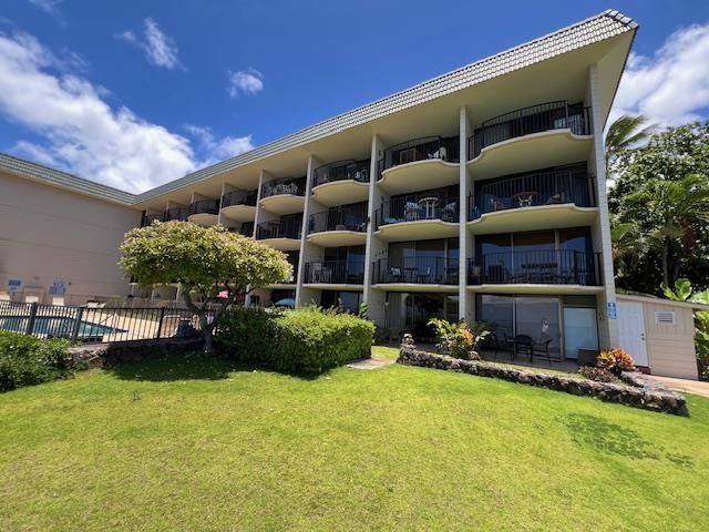 4471 Lower Honoapiilani Road, Unit 202 Lahaina, HI 96761 - Photo 11 of 24 a view of a house with backyard and sitting area