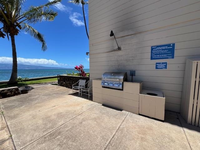 4471 Lower Honoapiilani Road, Unit 202 Lahaina, HI 96761 - Photo 15 of 24 a view of a livingroom with furniture and a fire pit