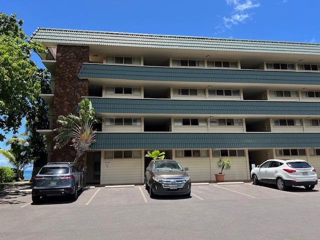 4471 Lower Honoapiilani Road, Unit 202 Lahaina, HI 96761 - Photo 19 of 24 a car parked in front of a building