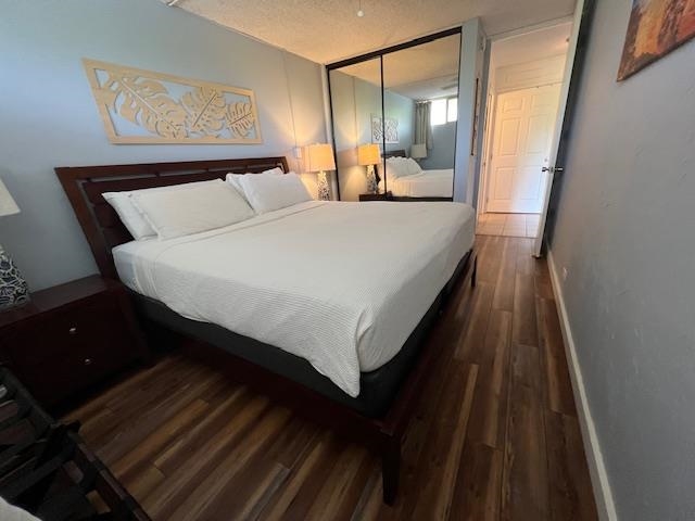4471 Lower Honoapiilani Road, Unit 202 Lahaina, HI 96761 - Photo 6 of 24 a bed room with a bed and a night stand