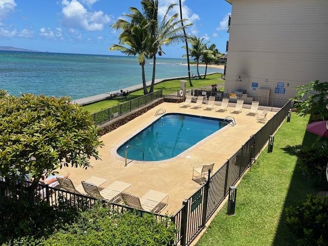4471 Lower Honoapiilani Road, Unit 202 Lahaina, HI 96761 - Photo 10 of 24 a view of a house with a swimming pool and ocean view