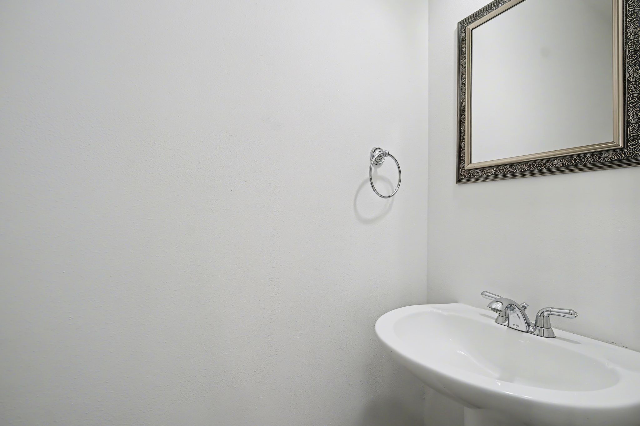 2416 Charleston Street, Unit A Houston, TX 77021 - Photo 12 of 24 a bathroom with a sink and mirror