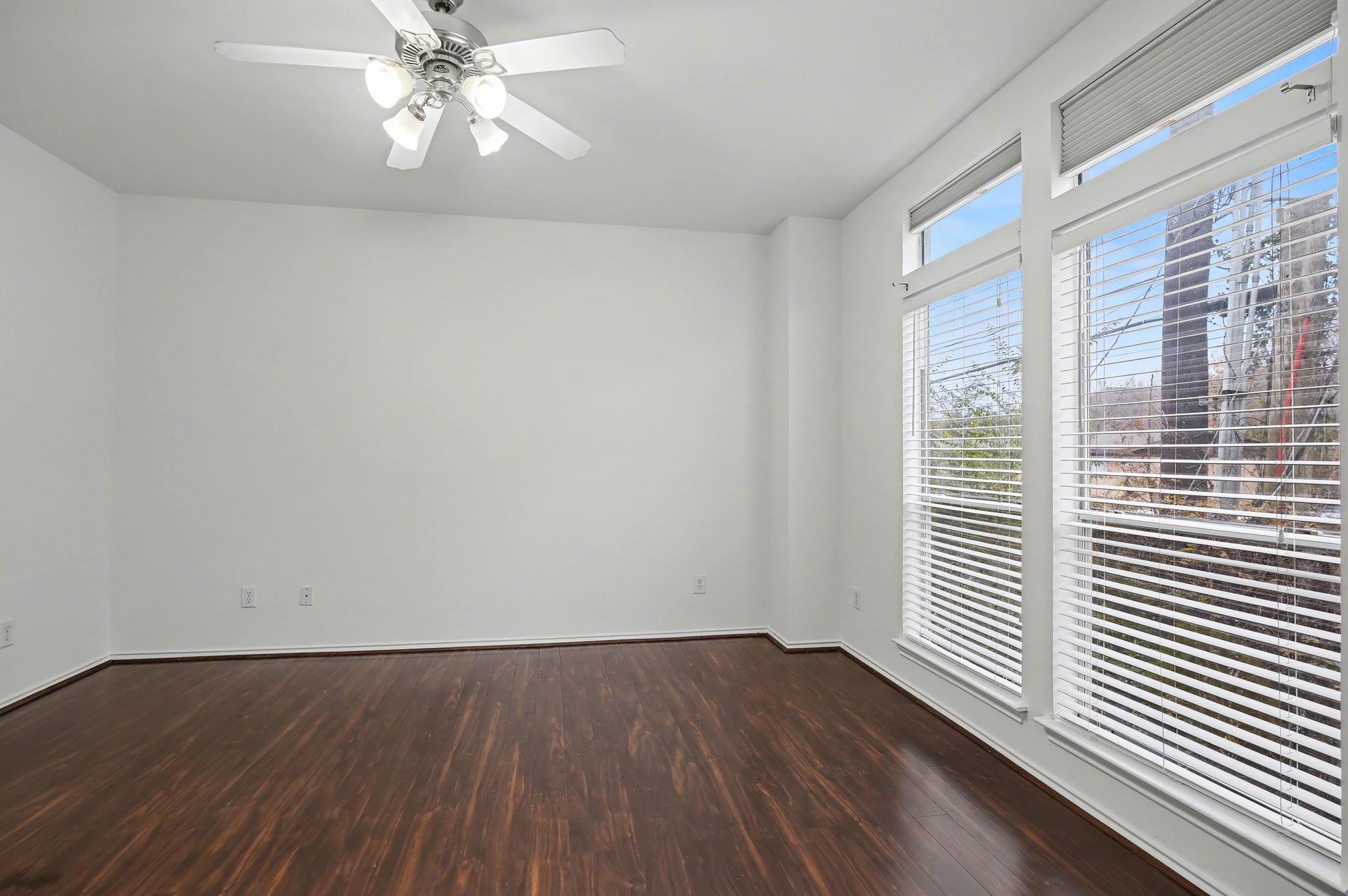 2416 Charleston Street, Unit A Houston, TX 77021 - Photo 13 of 24 wooden floor in an empty room with a window