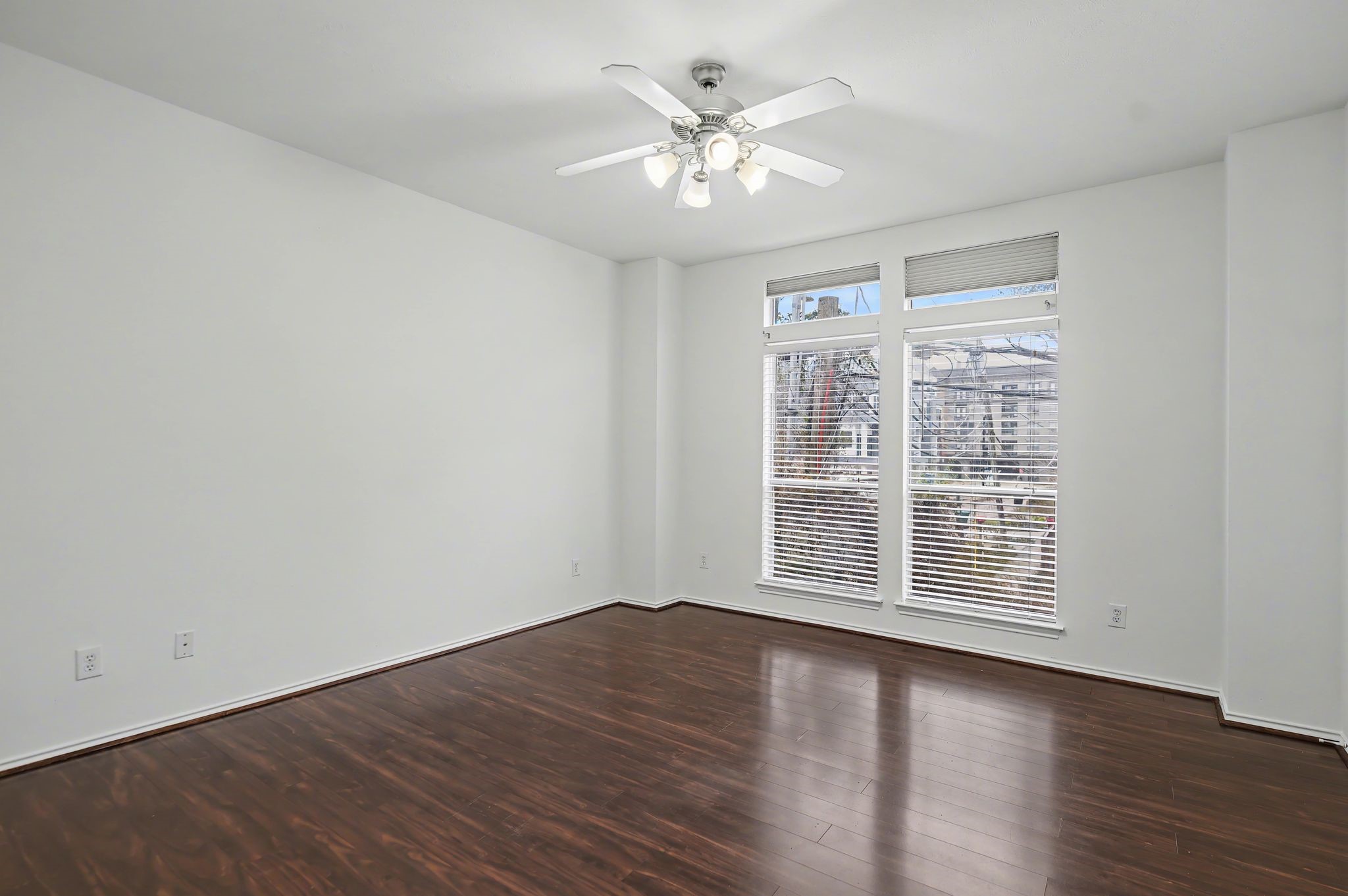 2416 Charleston Street, Unit A Houston, TX 77021 - Photo 14 of 24 wooden floor in an empty room with a window