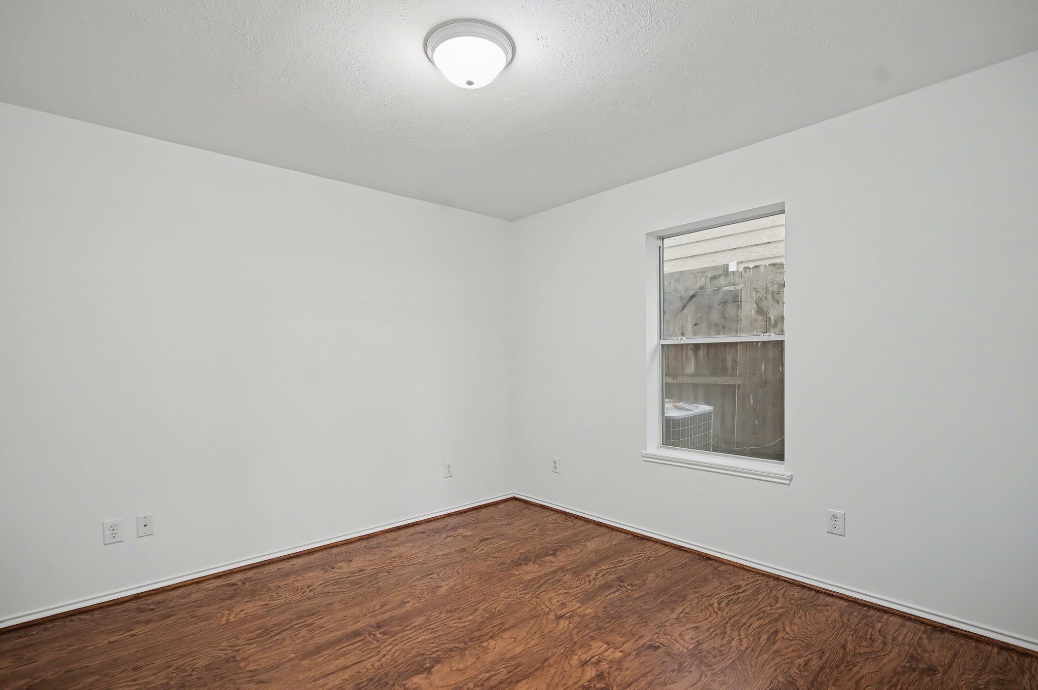 2416 Charleston Street, Unit A Houston, TX 77021 - Photo 15 of 24 an empty room with windows