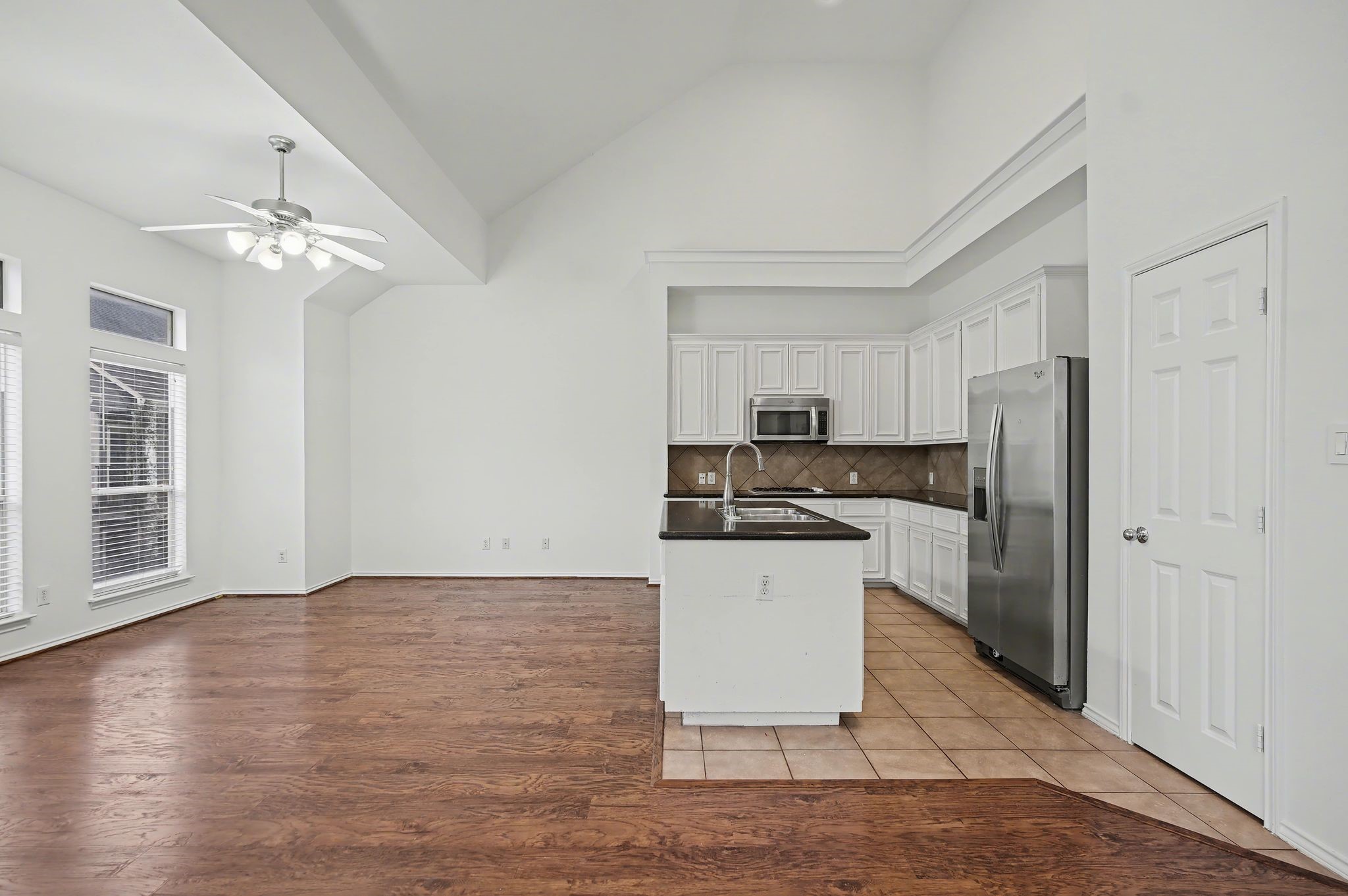 2416 Charleston Street, Unit A Houston, TX 77021 - Photo 4 of 24 a kitchen with a refrigerator a sink and a stove