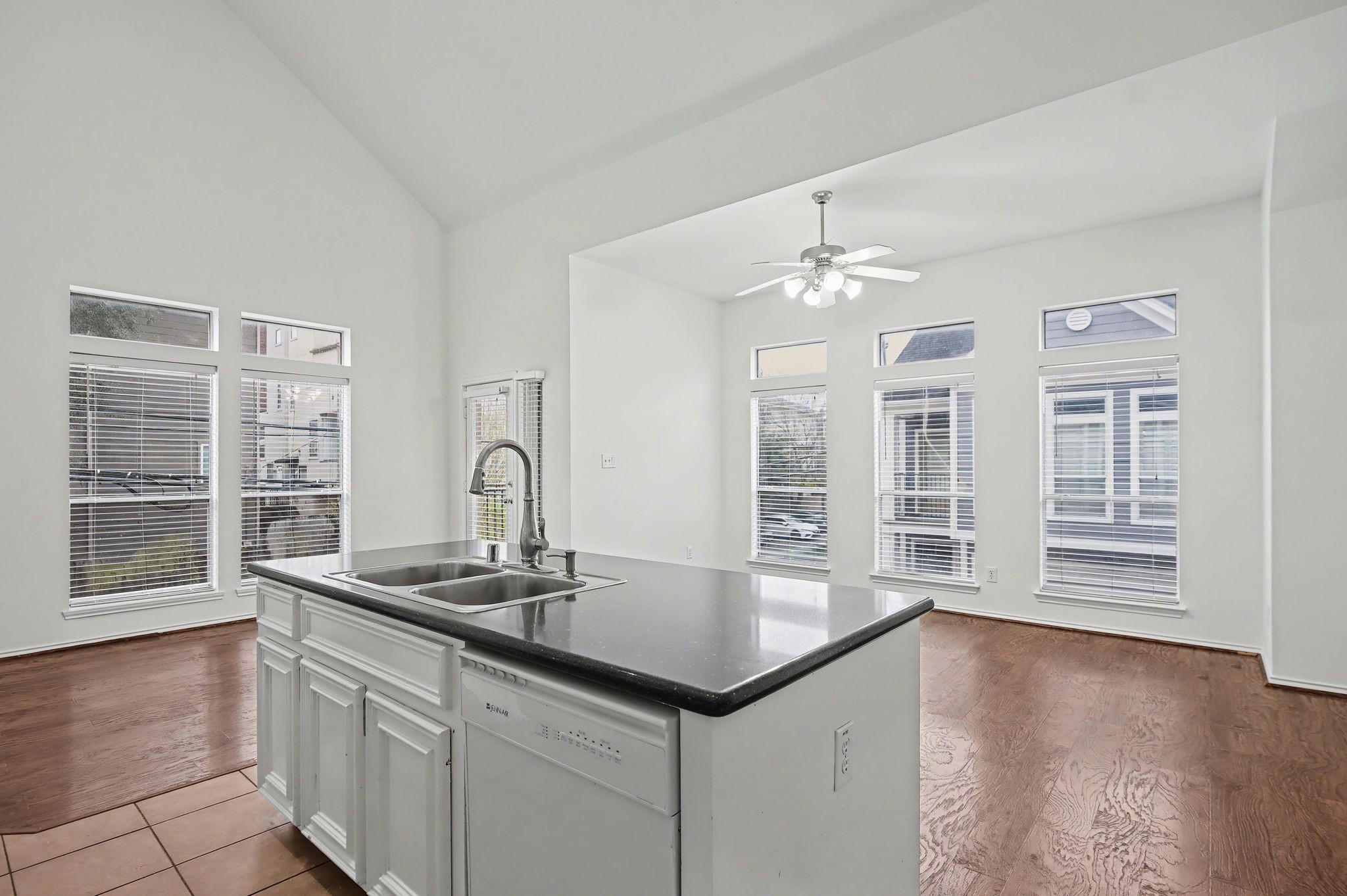 2416 Charleston Street, Unit A Houston, TX 77021 - Photo 7 of 24 a kitchen with granite countertop a stove and a sink with dishwasher