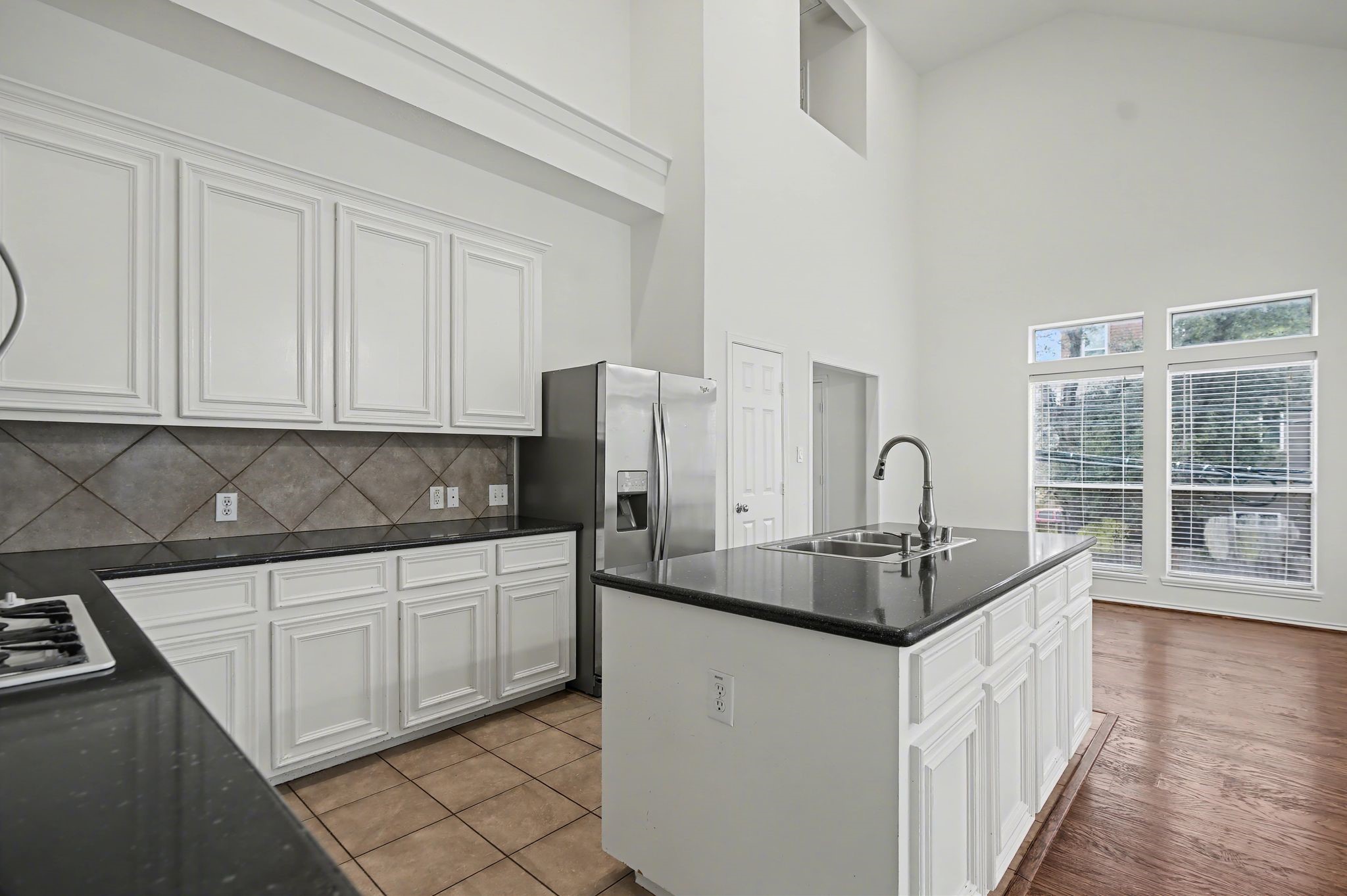 2416 Charleston Street, Unit A Houston, TX 77021 - Photo 9 of 24 a kitchen with stainless steel appliances granite countertop a sink and dishwasher with a granite countertops