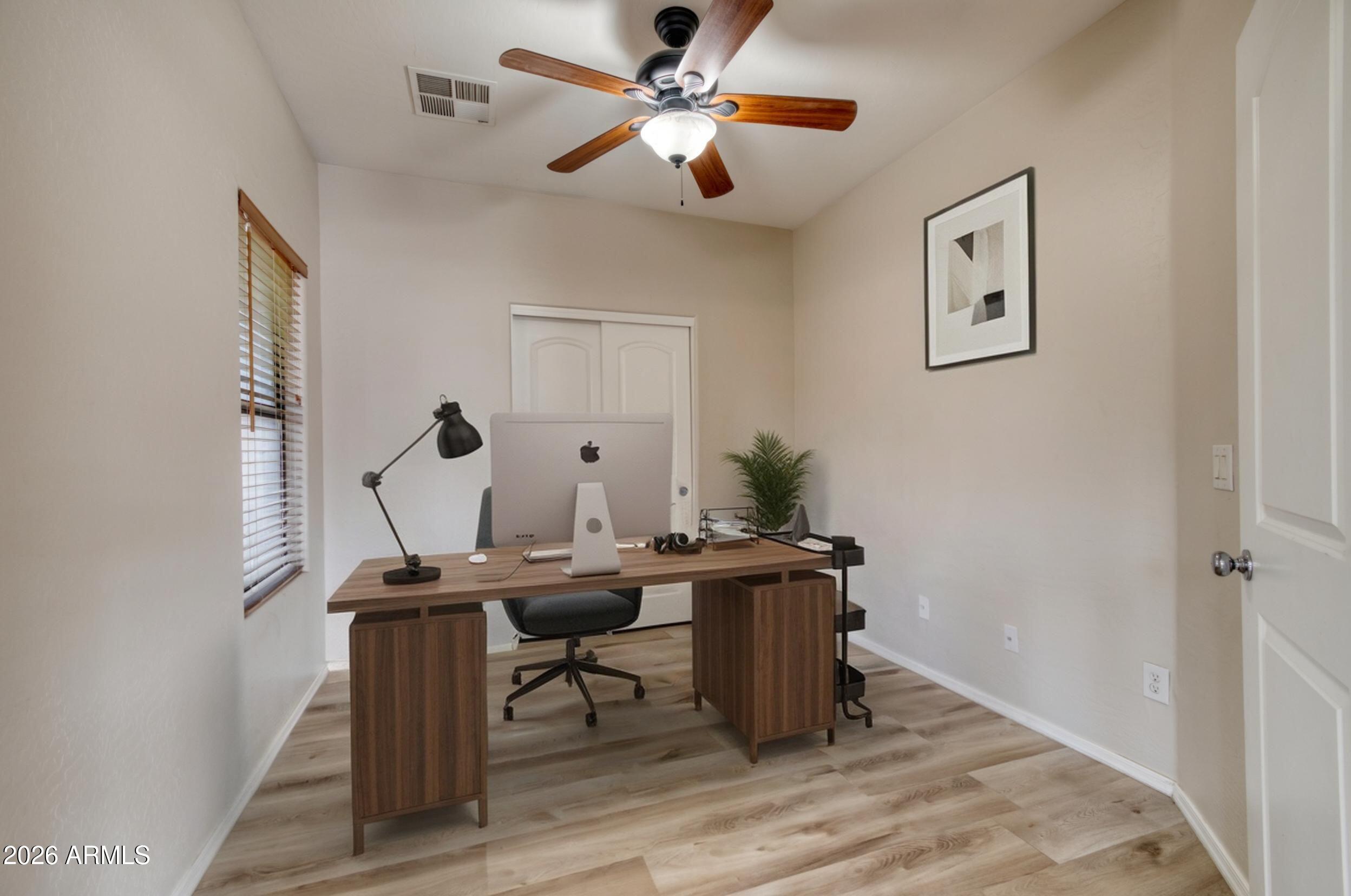 2565 South Signal Butte Road, Unit 46 Mesa, AZ 85209 - Photo 29 of 41 a view of a workspace with furniture and a window