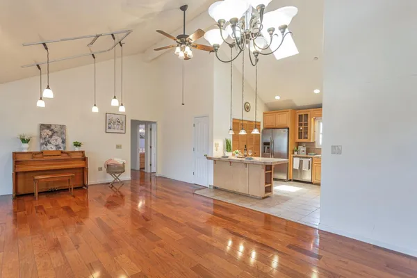 a view of kitchen and dining room with wooden floor