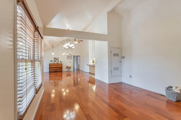 a view of a room with wooden floor