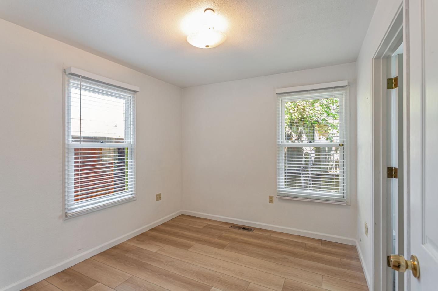 89 Hatton Avenue Spreckels, CA 93962 - Photo 16 of 29 a view of an empty room with wooden floor and a window