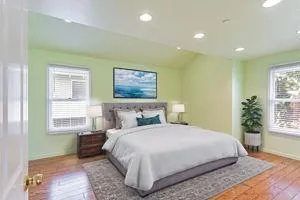 a bedroom with a large bed and a window