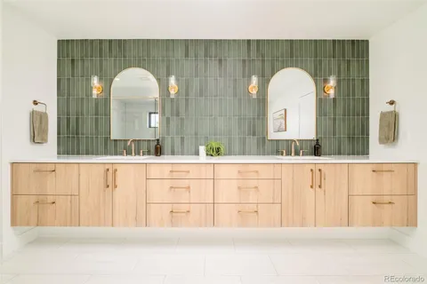 a bathroom with a sink mirror and vanity