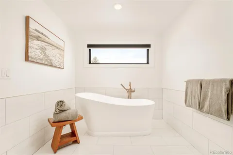 a bathroom with a bathtub and a sink