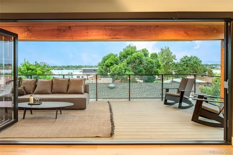 a view of swimming pool with seating space and furniture