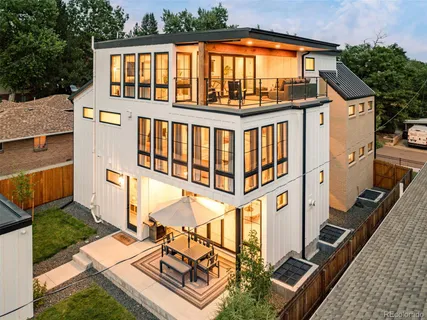 aerial view of a house with pool and yard