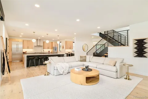 a living room with furniture and a table