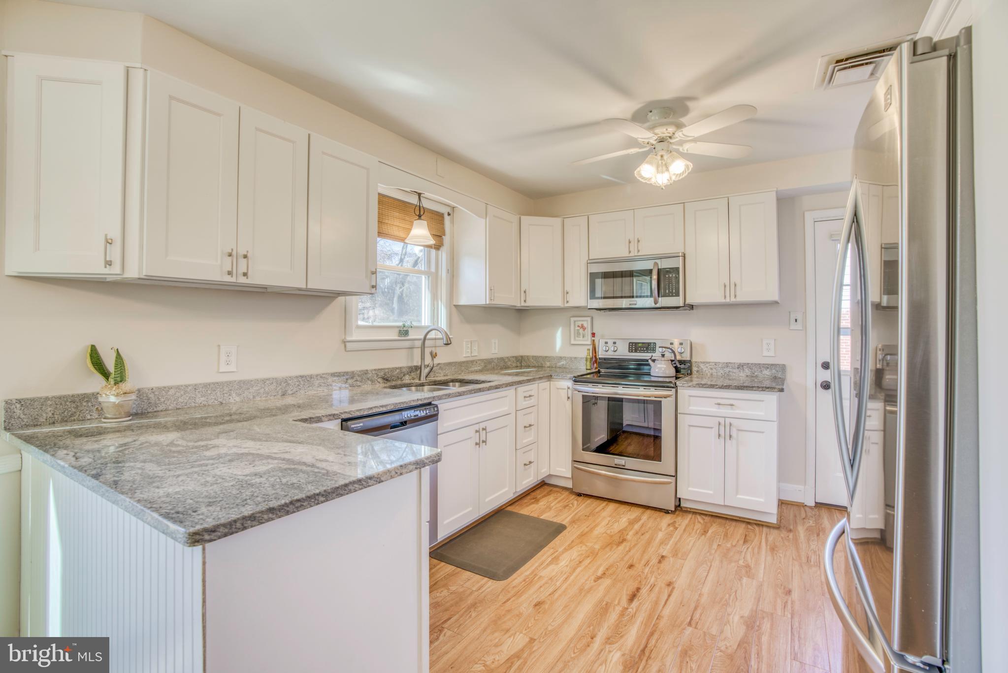 1305 Glendale Road Baltimore, MD 21239 - Photo 1 of 49 a kitchen with granite countertop stainless steel appliances sink and cabinets