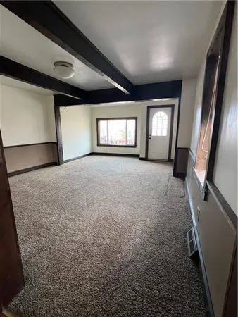 a view of open kitchen with granite countertop cabinets