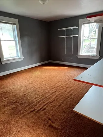 an empty room with windows