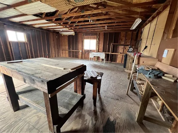 a kitchen with a sink and wooden cabinets