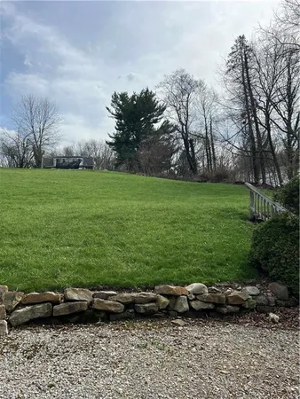 a view of a park with large trees