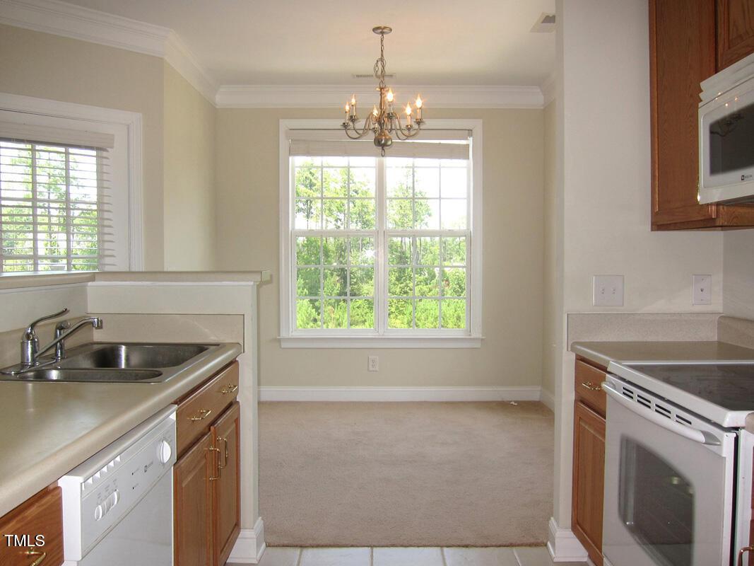 831 Providence Glen Drive Chapel Hill, NC 27514 - Photo 5 of 14 a kitchen that has a sink and cabinets