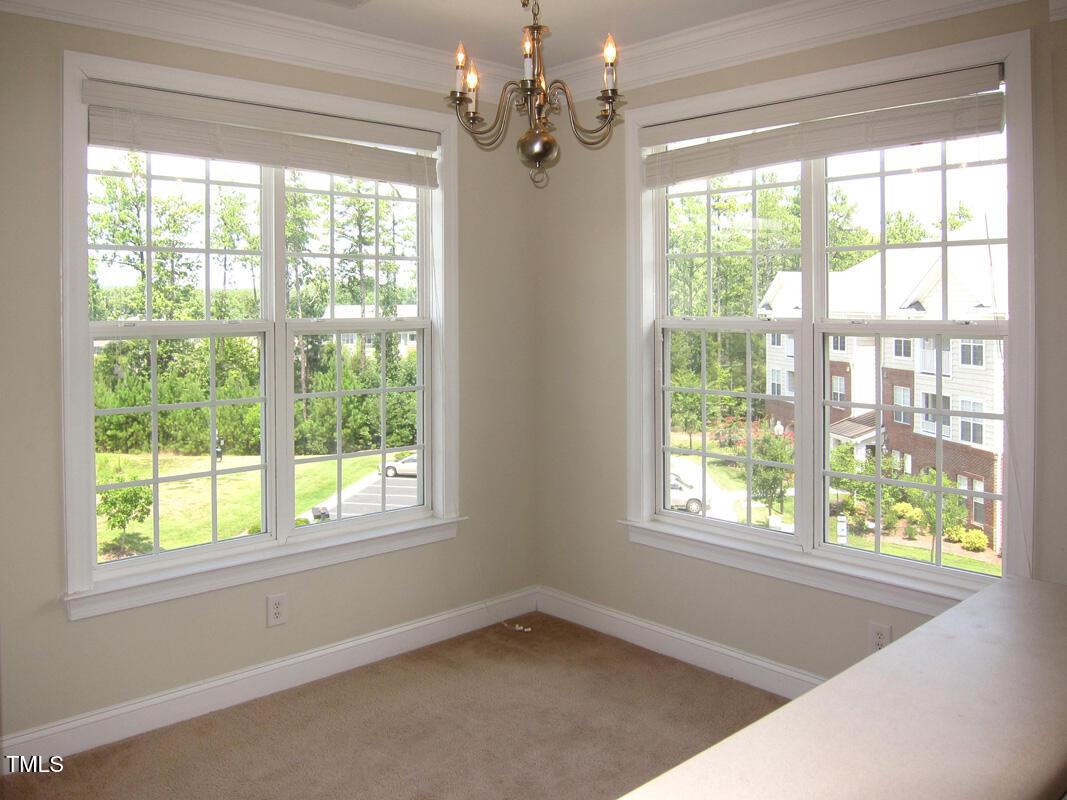 831 Providence Glen Drive Chapel Hill, NC 27514 - Photo 7 of 14 a view of an empty room with a window