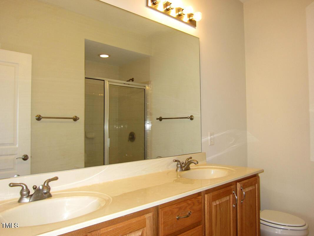 831 Providence Glen Drive Chapel Hill, NC 27514 - Photo 9 of 14 a bathroom with a sink and a mirror