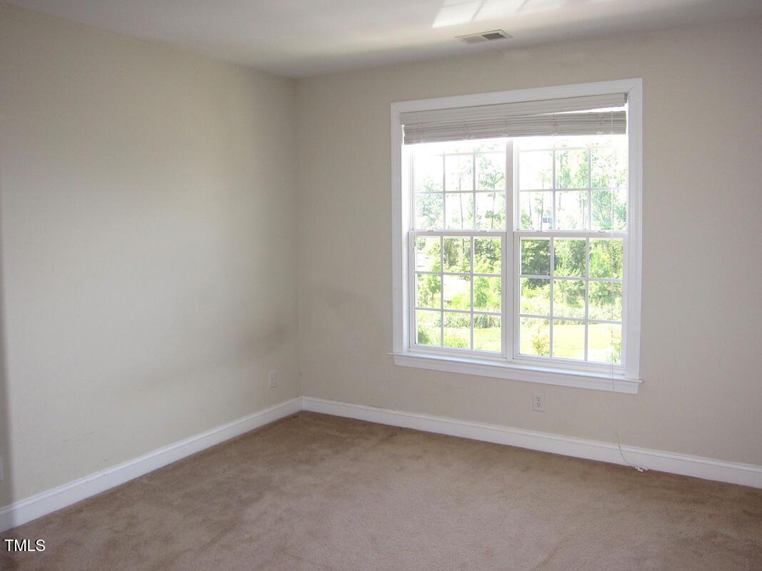 831 Providence Glen Drive Chapel Hill, NC 27514 - Photo 10 of 14 an empty room with a window