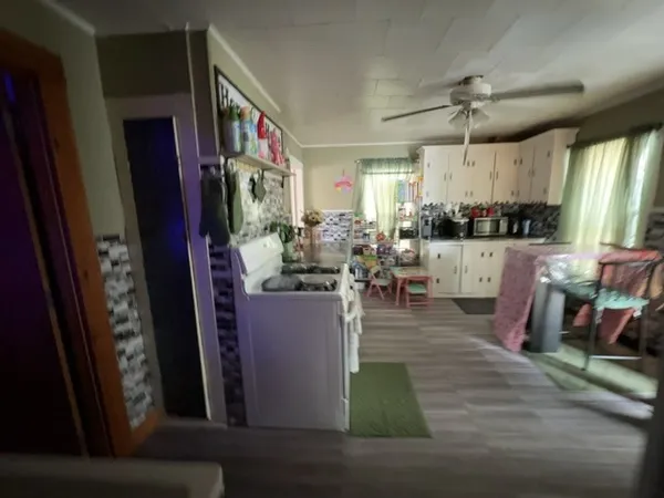 a room with lots of wooden furniture and appliances