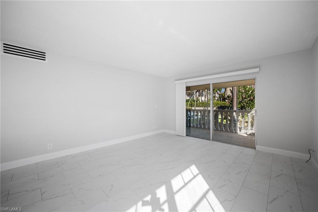666 3rd Street South, Unit 106 Naples, FL 34102 - Photo 11 of 32 an empty room with windows