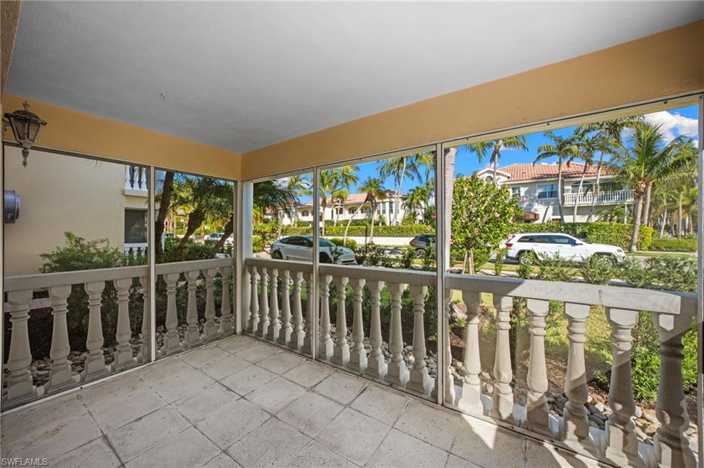 666 3rd Street South, Unit 106 Naples, FL 34102 - Photo 14 of 32 a view of a chairs and table in balcony